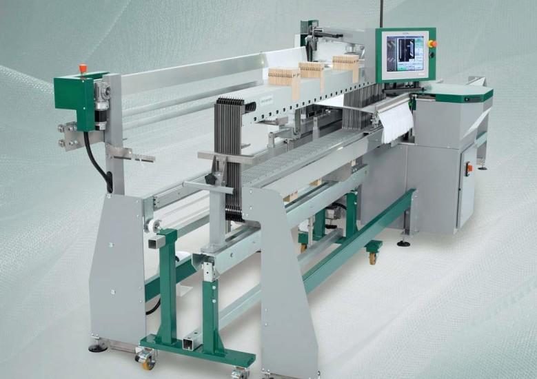 Drawing-in machine